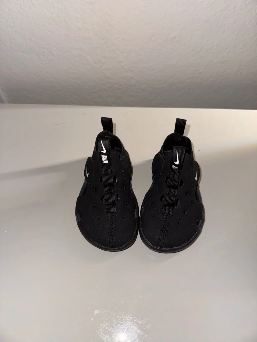 Nike Kids Black Slip-On Athletic Sneakers with White Swoosh